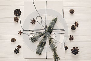 Stylish christmas rustic gift box flat lay. modern white present