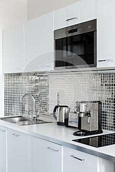 Stylish chrome kitchen interior close up