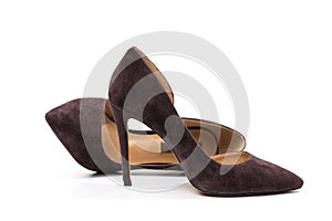 Stylish classic suede women`s leather shoes with medium high heels on an isolated white background. Shoe sale / clearance concept