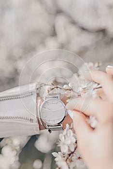 Stylish classic white watch on woman hand