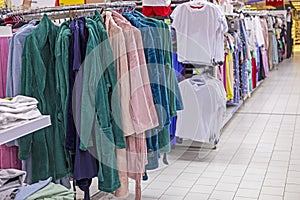 stylish clothes for home, bathrobes, T-shirts in the supermarket.