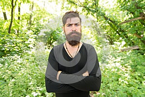 Stylish and comfortable. Serious stylish hipster on summer outdoor. Bearded man with stylish hair wearing casual tshirt