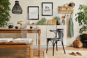 Stylish composition of cozy kitchen interior design with mock up poster frames, beige commode, wooden table, chair and bench.