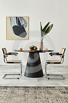 Stylish composition of dining room interior with design table, modern chairs, decoration, tropical leaf in vase, fruits, abstract.