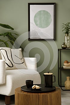 Stylish composition of living room interior with mock up, green wall, white armchair with brown pillow. Brown consola with