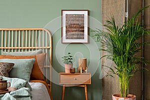 Stylish composition of modern bedroom interior. Mock up poster frame, wooden night table, bed, folding screen and creative