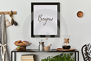 Stylish composition of modern kitchen interior design with mock up poster frame, black console and retro kitchen accessories.