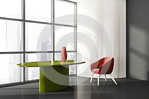Stylish composition of modern living room interior in skyscraper building with design armchair and green round table, vinyl floor