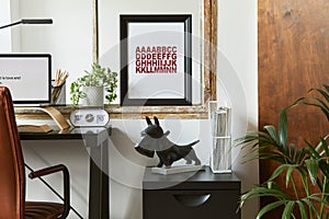 Stylish composition of modern masculine home office workspace interior with black industrial desk, brown leather armchair, laptop.