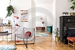 Stylish composition of retro living room with mock up poster frame, vintage furnitures, piano, decoration and personal accessories