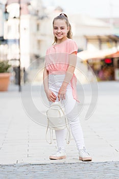 Stylish and confident. Little girl wearing fashion summer outfit. Small girl child with beauty look. Adorable girl with