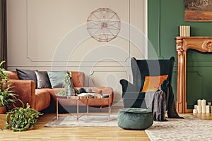 copper colored coffee table in front of comfortable corner sofa in trendy living room