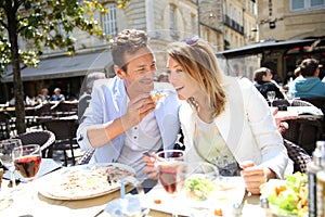 Stylish couple eating lunch in fancy restaurant