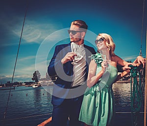 Stylish couple on a luxury yacht