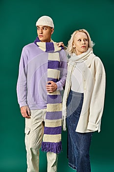 stylish couple in winter attire, blonde