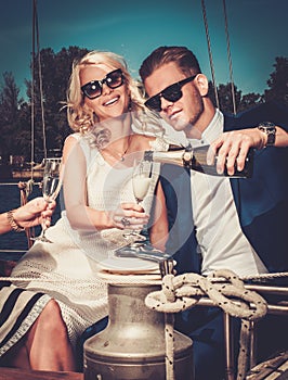 Stylish couple on a yacht