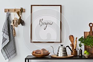 Stylish and cozy kitchen interior composition with mock up poster frame, black console, kitchen textile, teapot, plants and retro.