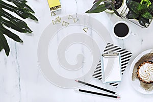 Stylish and creative composition of modern workspace with copy space and office accesories as pencils and notebooks. Copy space.