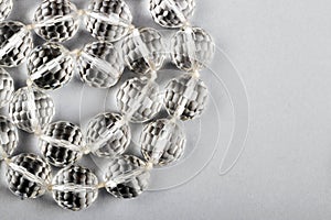 Stylish crystal beads on white background as a symbol of beauty