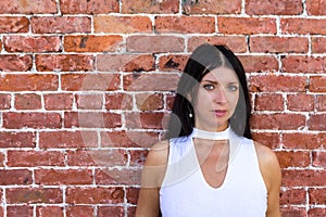 Stylish dark haired thoughtful woman