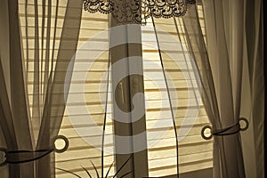 Stylish day-night blinds adorning a window in a modern indoor room.