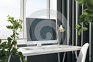 Stylish designer desktop with empty computer screen