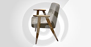Stylish designer grey chair with a wooden base isolated. Upholstered Designer Chair. Chairs in modern design. Comfortable