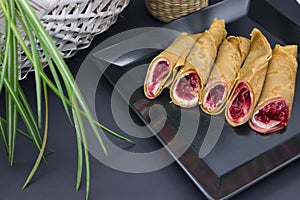 Stylish Dessert Crepes with Berry Filling