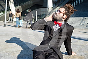 Stylish elegant dreadlocks businessman binoculars