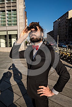 Stylish elegant dreadlocks businessman binoculars