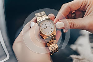 Stylish elegant gold watch on woman hand