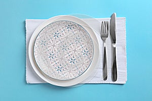 Stylish elegant table setting on color background