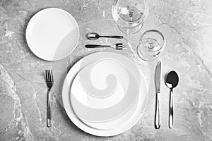 Stylish elegant table setting on grey marble surface