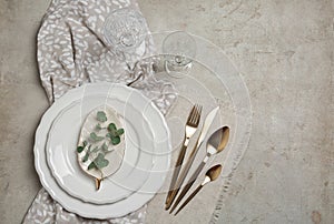 Stylish elegant table setting on light background. Space for text