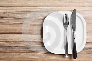 Stylish elegant table setting on wooden background. Space for text