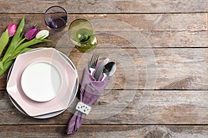 Stylish elegant table setting on wooden background, top view. Space