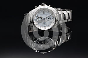 Stylish expensive men's wristwatch in titanium case