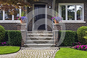 Stylish facade of an expensive residential home in summer