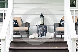 Cute stylish fall decorations on the front porch photo