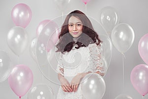 Stylish fashion asian woman with pastel balloons