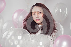 Stylish fashion asian woman with pastel balloons