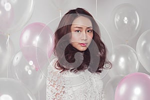 Stylish fashion asian woman with pastel balloons