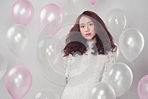 Stylish fashion asian woman with pastel balloons