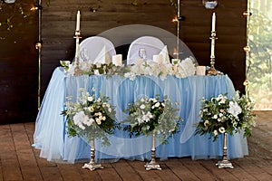 Stylish, fashionable wedding arch ceremony decorated with blue and white different flowers. Floral Design.Summer