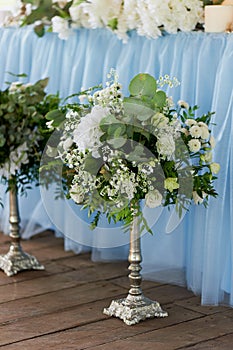 Stylish, fashionable wedding arch ceremony decorated with blue and white different flowers. Floral Design.Summer