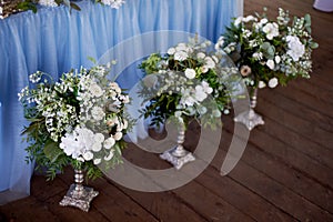 Stylish, fashionable wedding arch ceremony decorated with blue and white different flowers. Floral Design.Summer