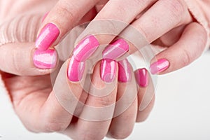 Stylish fashionable women& x27;s pink manicure closeup.