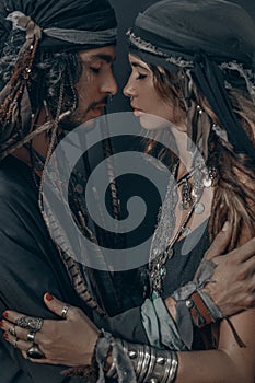 Stylish fashionable young handsome man and woman. gypsy fashion concept photo