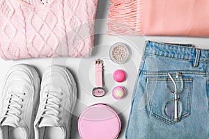 Stylish female autumn outfit and accessories on background, flat lay. Trendy warm clothes