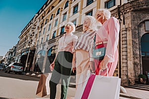 Stylish female pensioners are spending time together